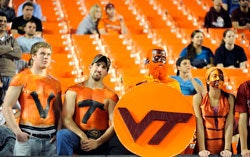 Photo of Virginia Tech football fans amid a number of empty seats at the Orange Bowl