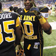 Heavily recruited linebacker C.J. Johnson smiled for the camera during the 2011 U.S. Army All-American Bowl, but he blamed Facebook for making the recruiting experience
