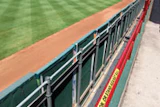 Until railing heights are adjusted at Rangers Ballpark, warning signs discourage fans from engaging in high-risk behaviors. (AP Photo/The Fort Worth Star-Telegram, Ron Jenkins)