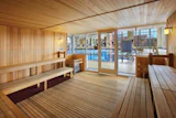Ample glass and a high-visibility location on the pool deck help discourage inappropriate uses of saunas and steam rooms. (Photo by Sam Fentress/Fentress Photography, courtesy of Hastings + Chivetta Architects Inc.)