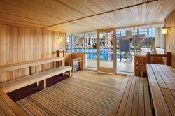 Ample glass and a high-visibility location on the pool deck help discourage inappropriate uses of saunas and steam rooms. (Photo by Sam Fentress/Fentress Photography, courtesy of Hastings + Chivetta Architects Inc.)