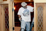 The Rev. James Johnson constructs the doorway to the new chapel at the Downtown YMCA in Birmingham, Ala., which opened in June. (Photo Courtesy of The Birmingham News/Mark Almond)