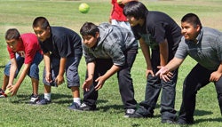 Middle school students practice softball drills during a recent physical education class in Bakersfield, Calif., where officials have laid off half the district's P.E. instructors. (Photo courtesy of Casey Christie/The Californian)