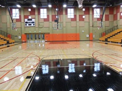 The best time to apply all court markings is prior to a gym floor's finishing process. (Photo courtesy of Maple Flooring Manufacturers Association)
