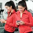 The ability to touch members via their mobile devices has become a popular facility software function. (Image © Punchstock)