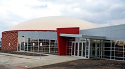 Multicolored brick and a bright entry prevent the Archie (Mo.) R-V School District's new monolithic dome gymnasium from looking like it