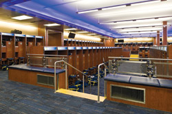SEATING BOWL Michigan's sunken football locker room places players on separate but visually connected tiers. (Photo by Paul Bednarski)