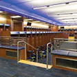SEATING BOWL Michigan's sunken football locker room places players on separate but visually connected tiers. (Photo by Paul Bednarski)