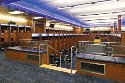 SEATING BOWL Michigan's sunken football locker room places players on separate but visually connected tiers. (Photo by Paul Bednarski)