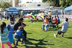 REDISCOVERING RECESS Converted school playgrounds provide a place not just for kids but also adults to engage in activity. (Photos Courtesy of People for Parks)