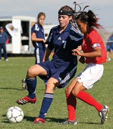 FASHION STATEMENT Open-crown headgear, like the kind worn by Lexy Ball of La Cueva (N.M.) High School, is becoming more common in girls' soccer. (AP Photo/Randy Siner)