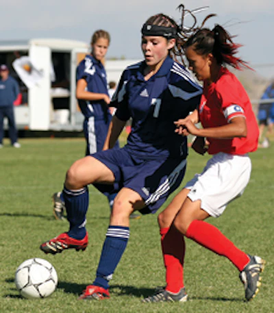 FASHION STATEMENT Open-crown headgear, like the kind worn by Lexy Ball of La Cueva (N.M.) High School, is becoming more common in girls' soccer. (AP Photo/Randy Siner)