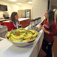 SMOOTHIE OPERATOR As the University of Alabama's director of performance nutrition, Amy Bragg (left) strategizes with student-athletes about food selection. (Photo courtesy of the University of Alabama)