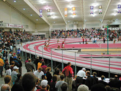 EXTRA LIFT A banked portable track, like the one used for the NCAA Division I National Championships at the University of Arkansas, offers one solution for facilities trying to get the most use out of space. (Photo Courtesy of Mondo USA)