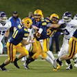 BATTLEGROUND STATE Cleveland's Saint Ignatius (in blue), an all-boys school, won its record 11th Ohio state football championship in 2011 with a 34-13 win over Pickerington Central - fueling calls for separate tournaments for public and non-public schools (Photo by Impact Action Sports Photography, courtesy of OHSAA)