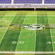 TIME TO FIX THE DOUGHNUTS Damage to the East Carolina University football field required an extra day of care. (Photo by The Daily Reflector)