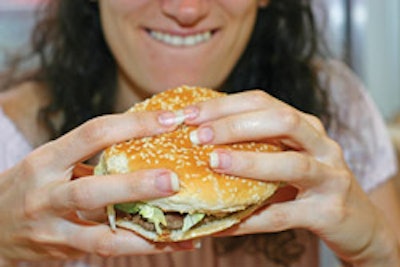 DROP THAT BURGER! The first steps toward helping people live healthier lives is telling them to eat less and walk more. (image DrRave/istockphoto.com)