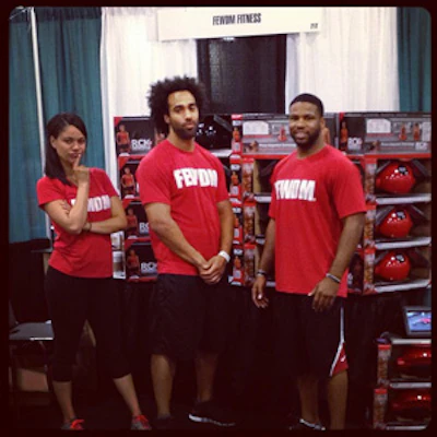Saunders (middle) poses with his fiance Kacie, and former teammate Tony Temple at a recent trade show.