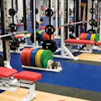 A NEEDED LIFT The days of simply installing 3⁄8-inch speckled rubber flooring in weight rooms are over as aesthetics, branding, performance and cleanability are prioritized in colleges and rec centers. (Univ South Methodist Weight Room)