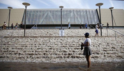Water pours down the steps of UCLA's Pauley Pavilion on Tuesday. (Image via @MoseBell on Twitter.)