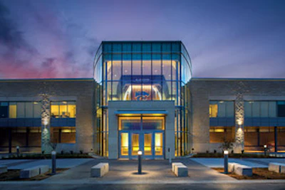 HIS AND HERS The design the basketball training facility at Kansas State gives the men's and women's programs their own personalized spaces while still making efficient use of shared areas. (Photos Courtesy of Populous) — Click here to see more