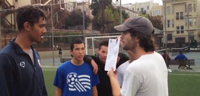 A San Francisco tech worker holds up the permit showing his group had paid to reserve the public field.