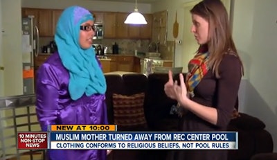 Sabah Ali (left) demonstrates what she was wearing in the Commerce City Recreation Center's pool in an interview with Jaclyn Allen of ABC 7 News in Denver.