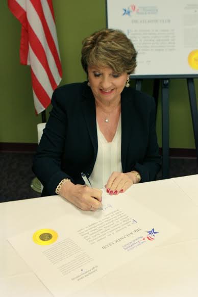 The Atlantic Club's Pat Laus signs the CEO Pledge.