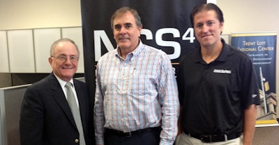 Van Milligen poses with Marciani (left) and Athletic Business president Peter Brown after deciding to launch Gameday Security.