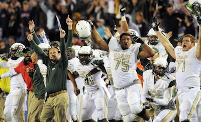 The UAB sideline erupts after the team defeated FAU on a last-second field goal. At 6-6, the Blazers are bowl-eligible for the first time since 2004. Photo via @UAB_Football on Twitter.