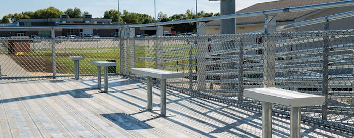 LOCATION, LOCATION Relegated to parking their wheelchairs on a ground-level track last season, wheelchair-using fans of Hampton-Dumont High School football now have their own elevated deck. (Photos courtesy of Kay Park Recreation)