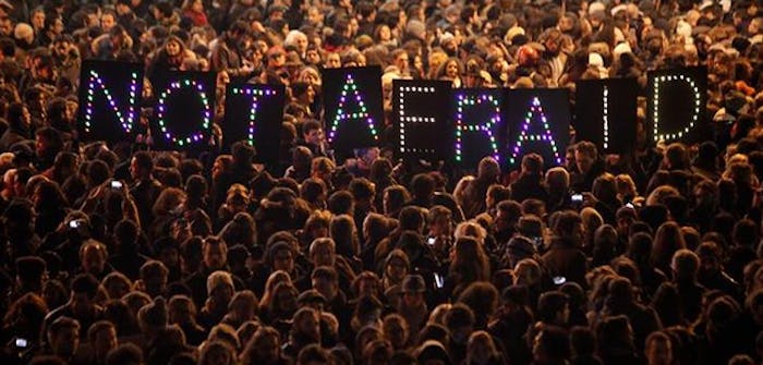 People gather in Paris to show support for the victims of the shooting at Charlie Hebdo. Photo via @JimDalrympleII on Twitter.