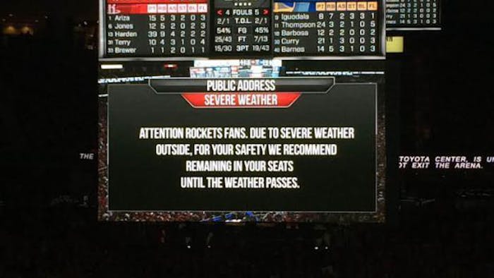 The Houston Rockets issue a public address asking fans to stay at the Toyota Center due to flooding
