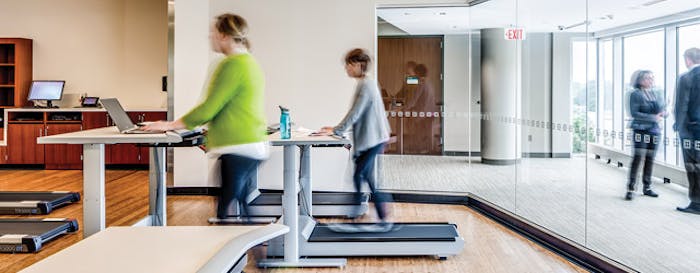 BUSY BODIES At the Mayo Clinic's Dan Abraham Healthy Living Center in Rochester, Minn., employees and other members benefit from on-campus fitness and wellness programs, health screenings, assessments and education. Treadmill desks are used to demonstrate opportunities to incorporate more activity into members' everyday lives. (Photos Courtesy of Dewberry)