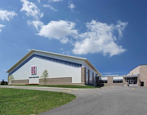 PRACTICE MADE PERFECT Hamilton High School's indoor facility fits well visually within the context of a rapidly modernizing campus. (Photo by Tricia Shay)