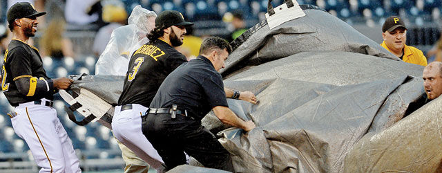The Pittsburgh Pirates grounds crew welcomed the cooperation of players in deploying a windblown tarp last summer. [Photo by Matt Freed]