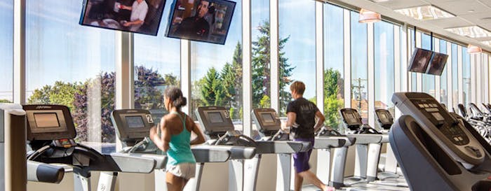Technology has increased the entertainment options for exercisers, but the basic ideas are still the same. [Photo by Ed White Photographics]