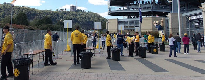 Contracted frontline security staff screen fans at Pittsburgh's Heinz Field. [Photo courtesy of Landmark Event Staffing]