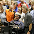 Augie Nieto (center) and wife Lynne during a 2016 visit to a Life Fitness Factory. (Photo courtesy of Life Fitness.)