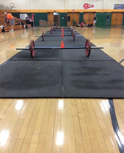 CrossFit event damages wood sport court [Image courtesy WoodFloorBusiness.com]