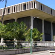 View of the Hawaii State Capitol with the Koʻolau mountains visible in the background.