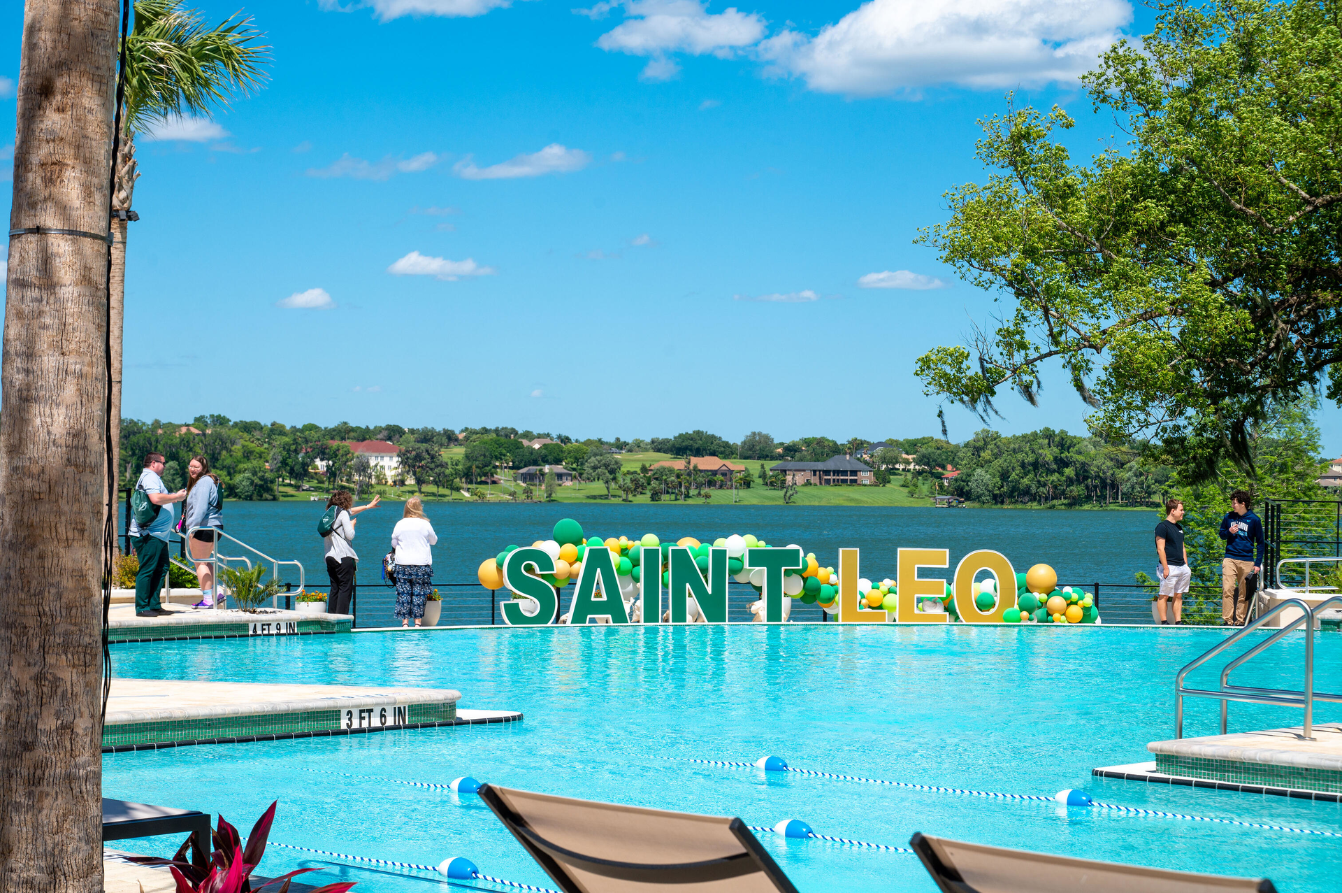 Outdoor amenities at the Saint Leo U. Wellness Center include an infinity-edged recreational pool, resort style seating, a fire pit, and a barbecue area &mdash; all with a beautiful view of Lake Jovita.