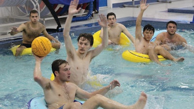 Students play inner tube water polo at American University.