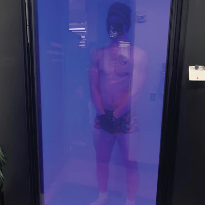 A Cyclone athlete recovering in a single-chamber cryotherapy system.