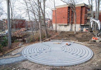 University of Rhode Island is making progress on a labyrinth installation on campus as part of a new Outdoor Wellness Patio.
