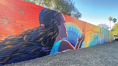 The name for San Jose’s “Mariposa Park” reflects the mural by Morgan Bricca on a highway soundwall adjacent to the park.