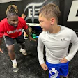 Former Atlanta Falcons linebacker Sean Weatherspoon trains with a young athlete at Legacy Sports Complex in Suwanee, Ga.