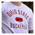 Smiling student in Ohio State Buckeyes shirt standing outdoors