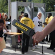 Security checkpoint with Garrett metal detector being used for screening
