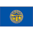Nebraska state flag with official blue seal showing landscape and statehood date